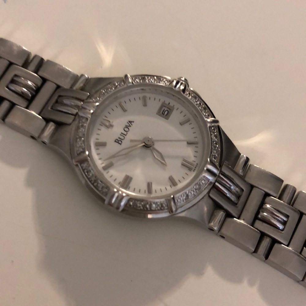 Bulova watch with small diamonds and extra link